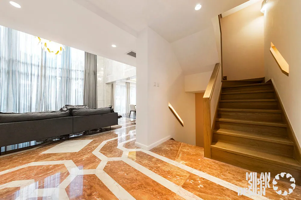 Hall with a patterned polished stone floor, wooden staircase and living room beyond, 4 Seasons Villa