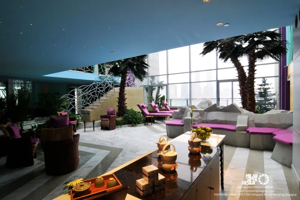 Spa lounge with pink cushions, palms and city views through glass walls, Yuyuan Renaissance Hotel